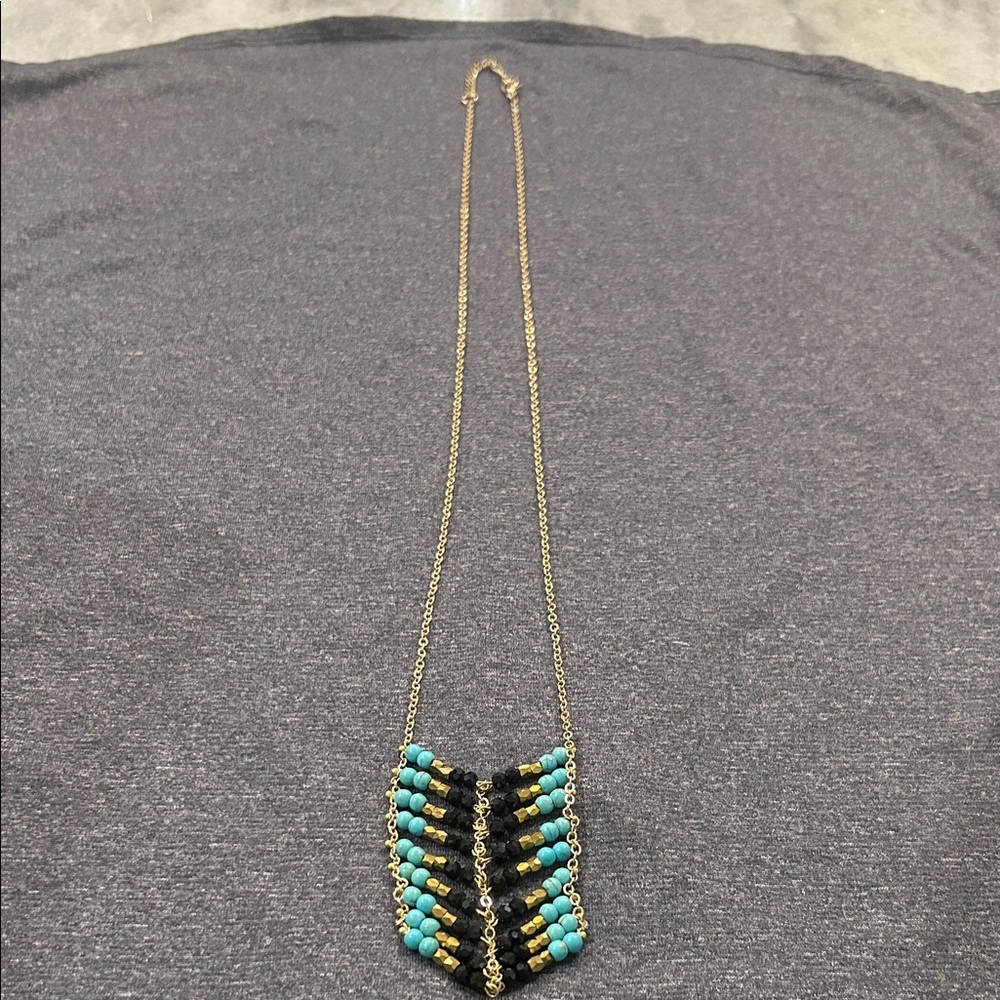 Beaded turquoise, black & gold Necklace with Gold Chain. Hangs approx 17”